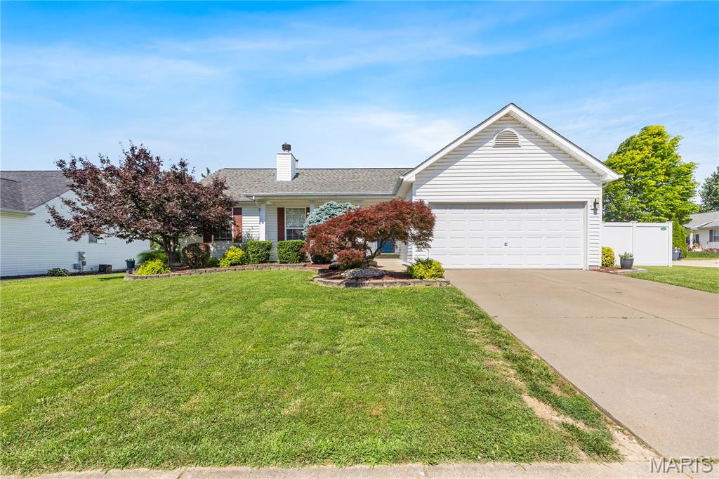 Welcome home to this spacious ranch offering over 2,100 square feet of finished living space, 3 bedrooms, 3 full bathrooms, and an oversized 2-car garage in a desirable neighborhood! Step inside to soaring vaulted ceilings and an inviting open-concept layout where the living room, complete with a cozy wood-burning fireplace, flows effortlessly into the kitchen and breakfast area. The kitchen features abundant cabinetry, stainless steel appliances, and a convenient main-floor laundry room with washer and dryer included. The primary suite offers a walk-in closet and private en-suite bath, while two additional bedrooms and a full bath complete the main level. Downstairs, the finished lower level is built for entertaining with an impressive custom wet bar featuring a sink, mini refrigerator, wine fridge, kegerator, plus a large recreation area, full bathroom, and plenty of storage. Outside, enjoy a fully fenced backyard with low-maintenance vinyl privacy fencing, an expansive 16x40 patio and pergola posts already in place for hanging twinkle lights—creating the perfect setting for relaxing evenings or hosting family and friends. With an oversized garage offering extended depth for additional storage or workspace, this move-in ready home checks all the boxes!