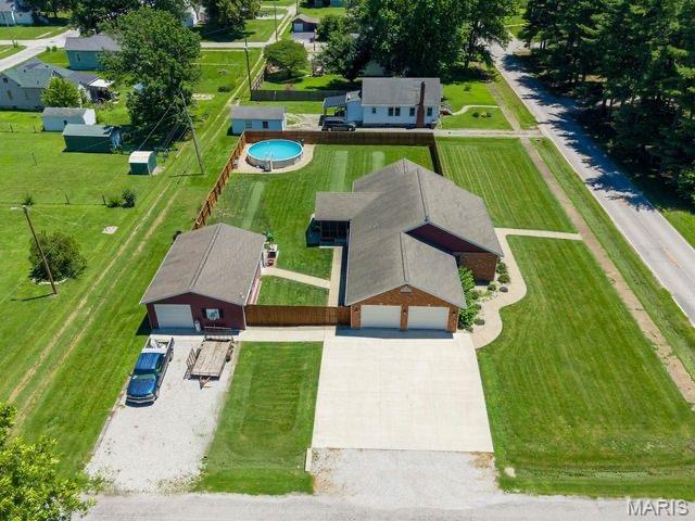 Spacious 5-Bedroom Brick Ranch on 2/3 Acre Corner Lot!
Welcome home to this beautifully maintained brick ranch offering approximately 2,900 square feet of finished living space on a desirable corner lot. With 5 bedrooms and 3 full baths, this home provides plenty of room for family, guests, and entertaining.
The main level features a spacious living room that flows seamlessly into the open kitchen and dining area, creating the perfect gathering space. The oversized primary suite offers a private full bath and plenty of room for a sitting area or additional furniture. Two additional bedrooms complete the upper level.
The finished lower level expands your living space with two large bedrooms, a full bath, a recreation room, a bonus room, and a dedicated home office—ideal for working from home, hobbies, or a home gym.
Step outside to enjoy the fully fenced backyard featuring an above-ground pool, screened porch, and plenty of room to relax or entertain. The attached two-car garage provides convenience, while the impressive detached outbuilding includes a bathroom and kitchen area, making it perfect as a workshop, pool house, hobby space, or potential entertaining area.
This property offers the space, versatility, and amenities you've been looking for—all on a generous 2/3-acre lot. Don't miss this exceptional opportunity!