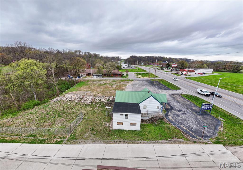 Prime Commercial Auction Opportunity – 1931 Kingshighway, Cape Girardeau, Missouri
This is more than a property. It is an opportunity to be part of Cape Girardeau’s expanding commercial corridor and invest in one of southeastern Missouri’s most dynamic markets.

Located along North Kingshighway, 1931 Kingshighway places you in the center of a thriving business hub that serves as the commercial backbone of Cape Girardeau. This stretch of roadway is among the highest traffic corridors in the region, connecting Interstate 55 to the city’s active retail, restaurant, and service districts. The property offers outstanding exposure, easy access, and direct connection to the businesses and neighborhoods that drive the local economy.

The parcel totals approximately 32,400 square feet (.74 Acres +/-) and is zoned C2 Highway Commercial, one of the city’s most versatile zoning designations. This allows a wide variety of uses including retail storefronts, offices, service operations, and mixed use redevelopment or new construction projects.

The existing building has recently been opened up, providing a strong structure and flexible interior that can be repurposed, remodeled, or completely transformed. Whether you are a local business owner ready to establish your next location, an investor seeking to reposition a property in a proven corridor, or a developer looking for a prime site with strong fundamentals, this property delivers a compelling value.

Surrounding the site are national retailers, restaurants, and service businesses that anchor this active commercial area. Major employers, healthcare facilities, and Southeast Missouri State University all contribute to the steady daytime population and economic activity that keep Kingshighway moving. Cape Girardeau’s role as a regional hub attracts shoppers, professionals, and visitors from across multiple counties, creating a constant flow of traffic and opportunity.

Infrastructure and access are excellent. Kingshighway provides multiple entry and exit points, and the property’s location offers convenient access to downtown Cape Girardeau, Interstate 55, and nearby retail centers. The visibility and signage potential here are exceptional, perfect for any brand that wants to stand out and be seen.

Cape Girardeau continues to experience steady commercial growth with a balanced economy supported by healthcare, education, logistics, and regional retail. The city’s planning and development programs have maintained a business friendly environment that encourages investment and redevelopment along major routes such as Kingshighway. That forward momentum makes properties like this increasingly rare.

1931 Kingshighway represents a unique chance to capture one of the last flexible parcels in a proven, high traffic location. With C2 Highway Commercial zoning, strong demographics, and unmatched exposure, the possibilities are wide open.

Do not miss this opportunity to buy at auction with a reserve price in place. Whether your goal is to operate, lease, or build, this property offers the foundation for long term success in one of Missouri’s strongest regional markets.