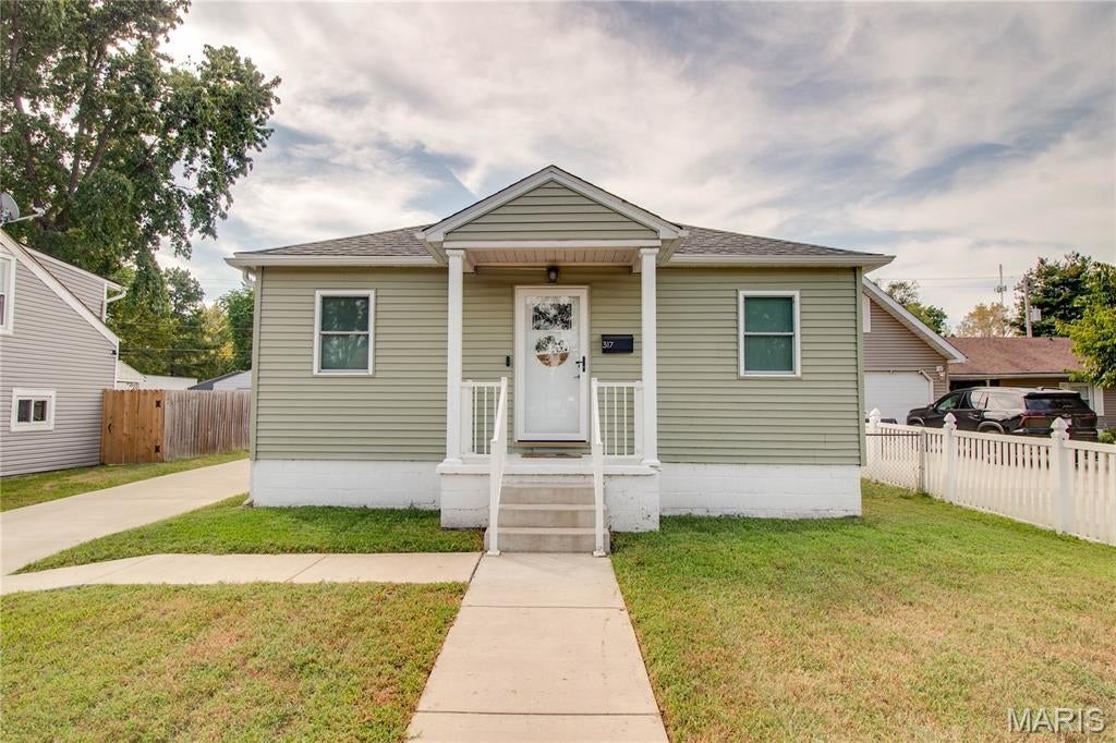 Check out this adorable and affordable 2 bedroom 1 bath home located in Roxana School District. FULLY renovated three years ago! New windows, furnace, a/c, water heater, wiring, insulation, fixtures, flooring, and full kitchen and bath updates make for a move-in ready home! Stainless steel appliances to stay. Roof is approximately seven years old. Covered front porch. Concrete driveway. Fenced back yard. Clean and tidy! This one is truly move-in ready and with all of the updates will give you peace of mind.