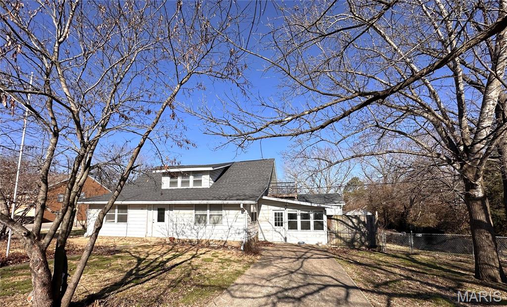 Check this out this five bedroom, two bath 1.5 story home, with large 14x30 tiled sun room, storm shelter, 12x12 deckoverlooking the fenced in back yard, a two car detached garage, with workshop area, and Central AC/Central Electric Heat. Home has living room and formal dining room with hardwood floors. Two bedrooms, and an office/ 6th bedroom located on the main floor, and three bedroom, and bath upstairs. $179,900 Additional Rooms: Sun Room