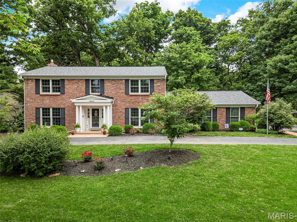 Welcome to 1842 Newburyport Drive, ideally situated on a quiet cul-de-sac in the heart of Chesterfield. This home offers fantastic curb appeal with a circle driveway and side-entry garage, creating a welcoming first impression while providing ample parking and functionality. Step inside to find beautiful wood floors throughout the main level and spacious living areas designed for both everyday living and entertaining. The inviting family room features a cozy fireplace flanked by built-in bookshelves, creating a warm focal point for gatherings. The home also offers separate formal living and dining rooms, ideal for hosting holidays and special occasions. The kitchen features granite countertops and a gas stove, offering both style and functionality for everyday cooking and entertaining. The large primary suite provides a comfortable retreat, while the updated bathrooms add a fresh, modern feel throughout the home. At the back of the home, a bright sunroom offers the perfect place to relax while enjoying views of the backyard. Step outside to the huge patio, ideal for outdoor dining and entertaining. Just beyond, a beautiful deck sits among the trees, creating a peaceful setting that feels like your own private oasis—perfect for morning coffee or unwinding at the end of the day. The expansive yard provides plenty of space for recreation, play, or gardening. The finished lower level adds valuable additional living space, perfect for a recreation room, media space, home gym, or play area and a large cedar closet. NEW ROOF and WATER HEATER 2025