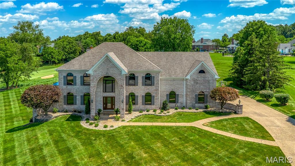 Commanding a premier 1.21-acre setting with breathtaking, uninterrupted views of Whitmoor’s South Course, this extraordinary full-brick estate is the epitome of refined luxury and timeless design. Designed without compromise, this residence reflects exceptional quality—from wide-plank hardwoods and intricate millwork to curated designer lighting and bespoke finishes. A grand, light-filled foyer introduces a showstopping floating staircase. Elegant formal spaces include a private study with French doors and a dining room designed for large gatherings. The great room stuns with a statement brick fireplace, custom built-ins, and a sophisticated wine bar. At the heart of the home, the designer kitchen is nothing short of spectacular. Custom inset white cabinetry, gleaming quartz countertops, a 10-foot statement island, and professional-grade appliances are complemented by iconic Ralph Lauren lighting—creating a space as functional as it is beautiful. Sun-drenched breakfast and sun rooms invite relaxed mornings and effortless entertaining. The primary suite is an unmatched sanctuary, featuring a private sitting room with fireplace, a meticulously designed walk-in closet, and a spa-caliber marble bath exquisitely reimagined by K-Build Design. The upper level continues with generous accommodations, including a secondary primary suite with vaulted ceilings and private staircase plus two secondary bedrooms and baths. Designed for both grand entertaining and everyday escape, the walk-out lower level offers a recreation room, game room with fireplace, and a cutting-edge media room. Step outside to a truly resort-caliber setting. The spectacular pool is surrounded by lush, professionally designed landscaping, expansive patios, and sweeping golf course vistas—creating a private outdoor oasis that rivals the finest retreats. With its rare combination of acreage, views, and unparalleled outdoor living. An offering of rare distinction, this estate redefines luxury living.