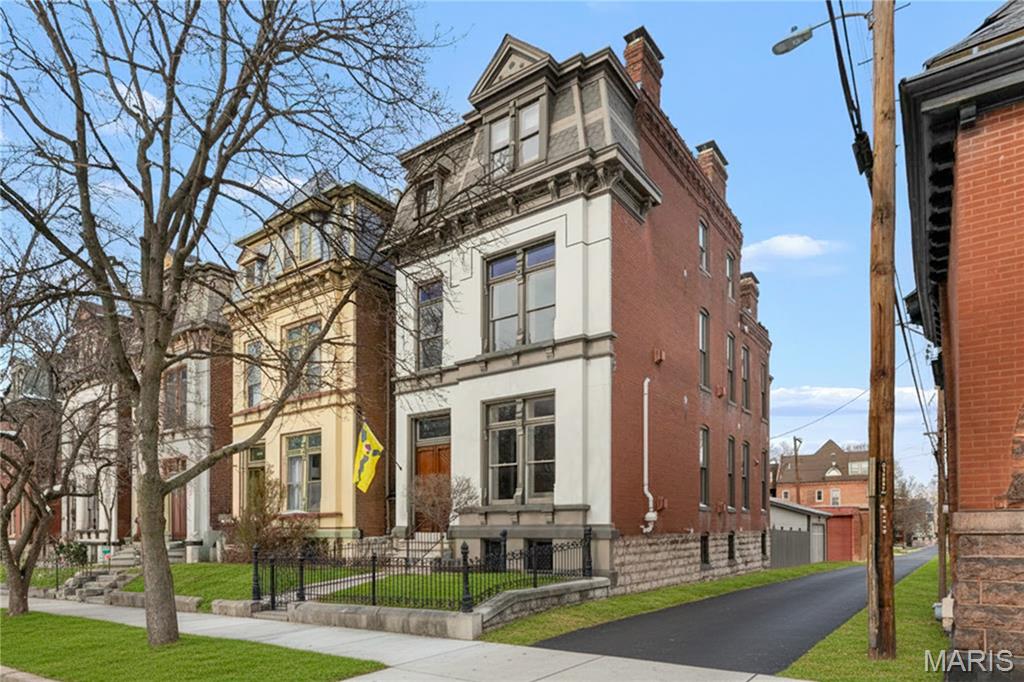 Perfection is not attainable but if we chase perfection we can catch excellence. Get ready to chase 2319 Whittemore Place. This home excels in every category with tasteful design and an impressive mixture of unbeatable old world quality with new top-of-the-line upgrades! Ideally located on a cul-de-sac street, one door away from incredible Lafayette Park, the location is top-notch and the upgrades and amenities can not be beat. A decorative iron fence encloses the front courtyard leading to the vestibule double doors. Inside, gleaming hardwood floors guide you through breathtaking rooms with fireplaces, crowned ceilings, and gorgeous chandeliers. Jaw dropping kitchen is open to a delightful family room with an open stairway to a finished lower level office suite that walks out level to a charming brick courtyard and three-bay garage.  Upstairs primary suite is palatial with a luxurious private bath and walk-in closet. One of two suites on the 2nd floor along with a full laundry room. Two top floor bedrooms have a Jack-and-Jill full bath. This house will exceed your expectations on every level.  Beautifully restored, updated, and meticulously maintained.