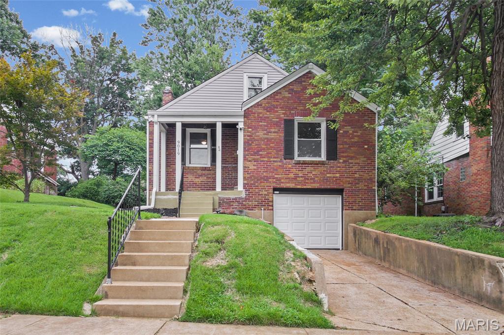 Charming 1.5-story brick bungalow in St. John, beautifully maintained and full of character. This home offers timeless appeal with archways, hardwood floors, and granite countertops. The freshly painted main level offers comfortable living spaces, two bedrooms, and a full bath, while the second floor features a third bedroom and versatile loft bonus space—perfect for a home office, playroom, game room, or additional family room. The basement completes the home with a finished recreation room, ample room for hobbies, plenty of storage, and convenient access to the tuck-under garage. Thoughtfully maintained and cared for, this home combines classic charm with the updates and improvements today's buyers are looking for. Conveniently located near parks, public transportation, shopping, dining, and Lambert-St. Louis International Airport. A wonderful place to call home!