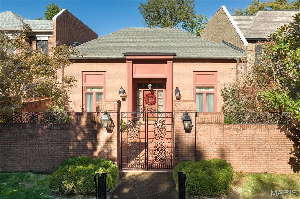Discover timeless luxury in this three-bedroom, four-and-a-half-bath villa offering 3,366 square feet of refined living space. Beyond the gated brick courtyard, this home welcomes you with 12-foot-high ceilings, checkerboard Italian marble flooring, intricate custom moldings, and exquisite architectural details throughout.  A newly renovated Kitchen is both stylish and functional, featuring thick quartz countertops with double-edged ogee, abundant storage, and premium finishes—perfect for both everyday living and entertaining. A charming dining area adjoins the Kitchen area.  Soaring ceilings, exquisite chandeliers and lighting , attention to details and rich hardwood flooring flows throughout the main living areas, accented by Scalamandre designer wallpaper that adds a touch of sophisticated elegance.  Each bedroom suite offers privacy and comfort, with luxurious baths and generous closets. An upper level offers flexibility for a third bedroom en suite bath or office. Additional Storage closet wrap around the upper level to provide an remarkable abundance of additional storage and a cedar closet.  Additional highlights of this fee simple Villa include an inviting gated courtyard entry ideal for your relaxing or hosting guests. Do not miss the terra cotta brick–floored two car garage featuring crown molding, white birch paneling, heaters and a pair of ceiling fans.  This fee simple villa combines classic design, modern amenities, and unmatched attention to detail—a rare opportunity for those seeking sophistication and comfort in a distinguished setting - with a remarkably low HOA fee. Note: Red Mirror in Master Bathroom and Kitchen Chandelier are excluded from sale and do not convey.