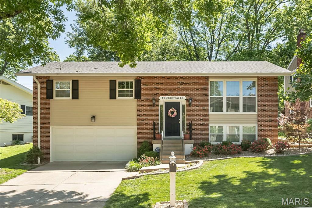 Welcome to Kirkwood living at its finest! Nestled in the highly sought-after Osage Hills/Greenbriar neighborhood, just moments from Greenbriar Hills Country Club and golf course, this immaculate, move-in ready 4 bedroom, 2.5 bath with over 1800 square feet of comfortable living exudes pride of ownership and offers the perfect blend of location, space, and lifestyle. The main level includes a cheerful, sun-drenched living room that opens seamlessly to the spacious dining room, perfect for entertaining or just relaxing at home. The charming kitchen offers crisp white cabinetry with gold pulls, granite countertops, quaint breakfast bar, tasteful wall of glass-front display cabinets and all-NEW stainless appliances in 2025. Down the hall you will find a full bath, primary suite with ensuite half bath and 2 additional spacious bedrooms. The lower level gives you more space to spread out and enjoy with a cozy family room, 4th bedroom and full bath. The private backyard with newer vinyl fencing and large patio is perfect for a morning coffee or relaxing after a long day. Noteworthy: Updated vinyl windows, newer roof-2020, electric panel-2025, front landscaping-2021. Enjoy the perks of neighborhood tennis courts and the convenience of being just steps away from a bird sanctuary and Monfort Park that includes playgrounds, a pavilion and walking path. This is more than a home, it's a lifestyle!