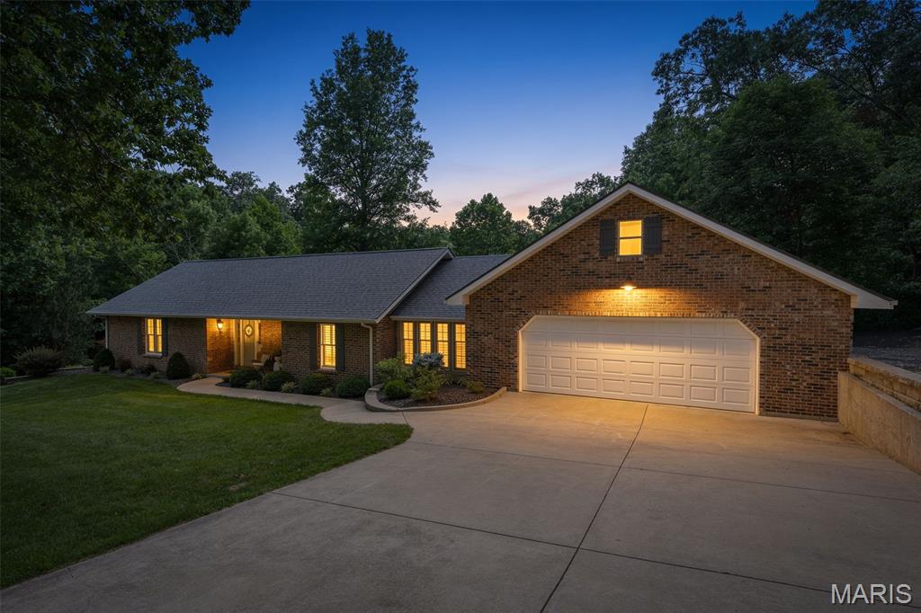 Location! Location! Don’t miss this incredible opportunity. Situated just outside the city limits, this spacious 4-bedroom, 3-full-bath ranch home offers a private setting with plenty of room to enjoy. The open floor plan features a large updated kitchen with appliances included, a breakfast bar, and an adjoining dining room and sunroom area—perfect for everyday living and entertaining.  Step outside to enjoy the full-length composite deck and concrete patio spanning the back of the home, ideal for relaxing or hosting gatherings.

The inviting living room showcases a cozy gas fireplace, while wood flooring adds warmth and character throughout portions of the main level. A dedicated office space and main-floor laundry provide added convenience. The spacious primary suite includes a full bath with a beautifully tiled walk-in shower.

The finished lower level that walks out offers a large family room, additional bedrooms, a full bath, and ample storage space. 

Additional features include a 2-car attached garage equipped with its own mini-split system. Recent updates include a new roof (2025), septic system pumped (2025), garage mini-split installed (2024), shed added (2026), and all new lower-level flooring (2024).

Beautifully landscaped and nestled in a private setting, this well-maintained home offers comfort, space, and so much more.