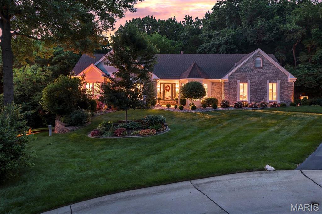 OPEN HOUSES Sat. May 30th and Sun. May 31st are both cancelled.  Experience refined living in this exceptional 3,990-sq-ft luxury residence located in The Moorings Subdivision. This home has Lake Rights and is tucked away on a quiet, wooded cul-de-sac in the heart of Lake St. Louis. Every detail has been elevated: new maple hardwood floors, 10’ ceilings, and two gas fireplaces set the tone for a home that blends warmth with sophistication. The main-level primary suite is a true retreat, featuring a spa-inspired bath with custom tile shower, soaking tub, and heated floors, plus private access to one of the home’s two composite decks.  Near the primary suite is a large room serving as a bedroom but could also be a home office or den.  The gourmet kitchen impresses with a Wolf oven and cooktop, solid-surface countertops, stainless steel appliances, and an inviting breakfast room. A separate great room, dining room, and a skylit mudroom add both function and elegance. The fully finished basement expands your living and entertaining space with a wet bar, generous family room, and three bedrooms plus two full bathrooms, including one with double vanities and heated flooring. Outside, enjoy the serenity of mature trees surrounding the property and the convenience of new garage doors on both the 2-car and separate 1-car garages. As part of the Lake St. Louis Community Association, you’ll enjoy exclusive access to a private clubhouse, pool, golf course, beach, pickleball, and tennis courts. All of this comes with unbeatable proximity to I-64 and I-70, The Meadows shopping & dining, Boulevard Park, and highly rated Green Tree Elementary. This is a rare opportunity to own a luxury home that offers privacy, craftsmanship, and resort-style amenities. Schedule your private showing today and experience the lifestyle that awaits you in Lake St. Louis at 11 Forest Knoll Circle!