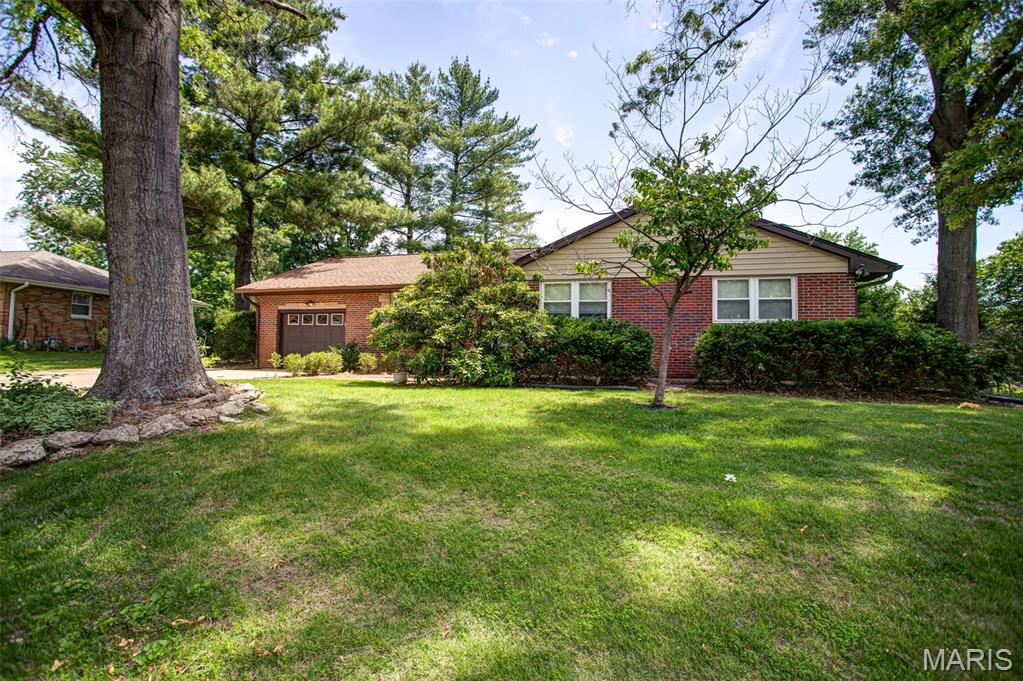 Your Great Opportunity Awaits!!  New Price Adjustment! 3 bedroom 2 bath brick home in established neighborhood in Godfrey.   Plenty of cabinets in kitchen with breakfast area.  Large living room that steps out to sunroom. Lower level with small kitchenette and semi finished area.  Lots of opportunity for added living space.  Washer /dryer and Refrigerator in basement. Attached garage and plenty of parking space. Roof approx. 10 years, HVAC in 2022