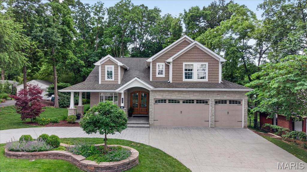Built in 2014, this custom Kirkwood home blends high-end finishes, thoughtful design and exceptional indoor-outdoor living. Rich hardwood floors, detailed millwork, coffered ceilings and oversized windows create a warm, elegant feel throughout the main level. The open kitchen features custom cabinetry, a large center island and seamless connection to the breakfast room, dining area and vaulted family room, making the home ideal for both entertaining and everyday living. The main floor master suite is a true retreat with a beautifully updated spa-inspired bath, generous walk-in closet and peaceful views of the private backyard. Upstairs offers 2 additional bedrooms and a full bath, while the finished lower level includes a large rec area, custom bar, 4th bedroom + 4th full bathroom and abundant flexible living space. Outside, the incredible screened porch and adjoining patio overlook a beautifully landscaped yard backing to a wooded undeveloped lot, creating rare privacy and a tranquil setting year round. Additional highlights include a 3-car attached garage, custom shades, solid wood doors, updated stair carpeting and exceptional attention to detail throughout. This property is the picture of efficiency, with everything you need and none of what you don't.