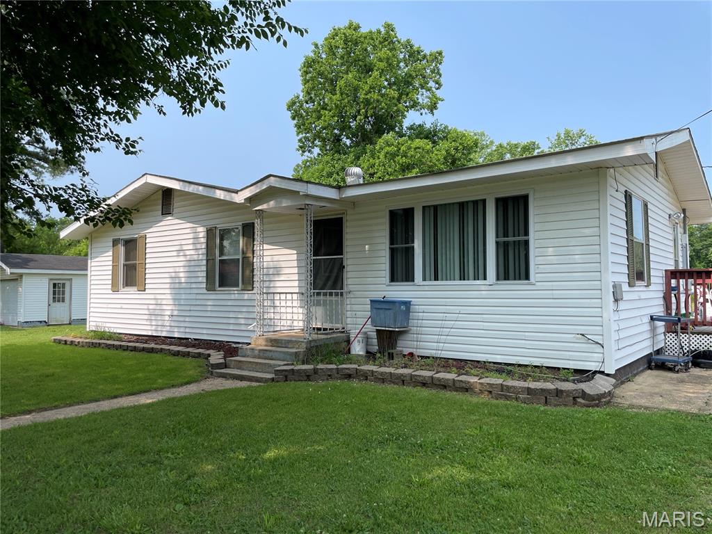 Comfortable, vinyl sided home sitting on a large, level corner lot. Spacious 4-bedroom house, 2-bath with living room and eat-in kitchen with appliances. Split bedroom set-up with the primary bedroom, bath and walk in closet separate from the other 3-bedrooms and full bath. Roomy 28 x 16 side deck with access from kitchen and primary bedroom. Detached 13 x 25 garage and workshop. Garden spot and plenty of room for the kids to play or family entertaining. Just minutes from beautiful Clearwater Lake.