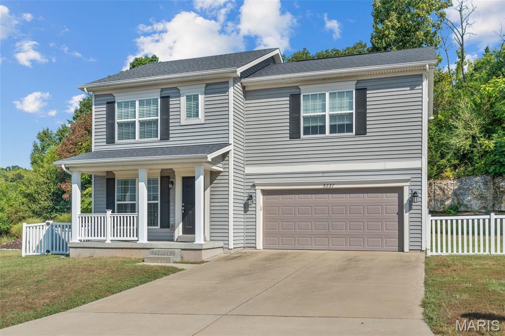 Welcome home to this  3-bedroom, 2.5-bath two-story, offering a functional layout, generous outdoor space, and plenty of opportunity to grow. The inviting main level provides comfortable living and entertaining spaces, with an open concept,  while all three bedrooms are tucked upstairs, including a spacious primary suite with a private ensuite bath complete with a walk-in shower complete with bench. Laundry room conveniently located on upper level for ease. 
An attached 2-car garage adds everyday convenience.

The unfinished lower level offers excellent potential for additional finished living space, complete with an egress window—ideal for a future family room, home office, recreation area, or additional sleeping space.

Outside is where this property really stands apart. Enjoy a large fenced yard, expansive concrete patio perfect for entertaining, and a striking natural rock backdrop that gives the property character and ultimate privacy that you simply don't find with every neighborhood home. A covered front porch adds even more charm and a welcoming place to relax.

Built in 2017, this home combines newer construction, room to expand, a great yard, and a setting with a little something extra—all while keeping you close to the everyday conveniences of Imperial.