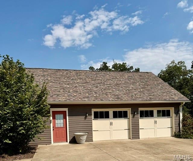 This property has a large pond, 16+ acres with county road frontage, fencing, cross fencing and shared driveway. There is also a two car over-sized garage; along with a historical school house that was built in 1903. Property has also been surveyed.