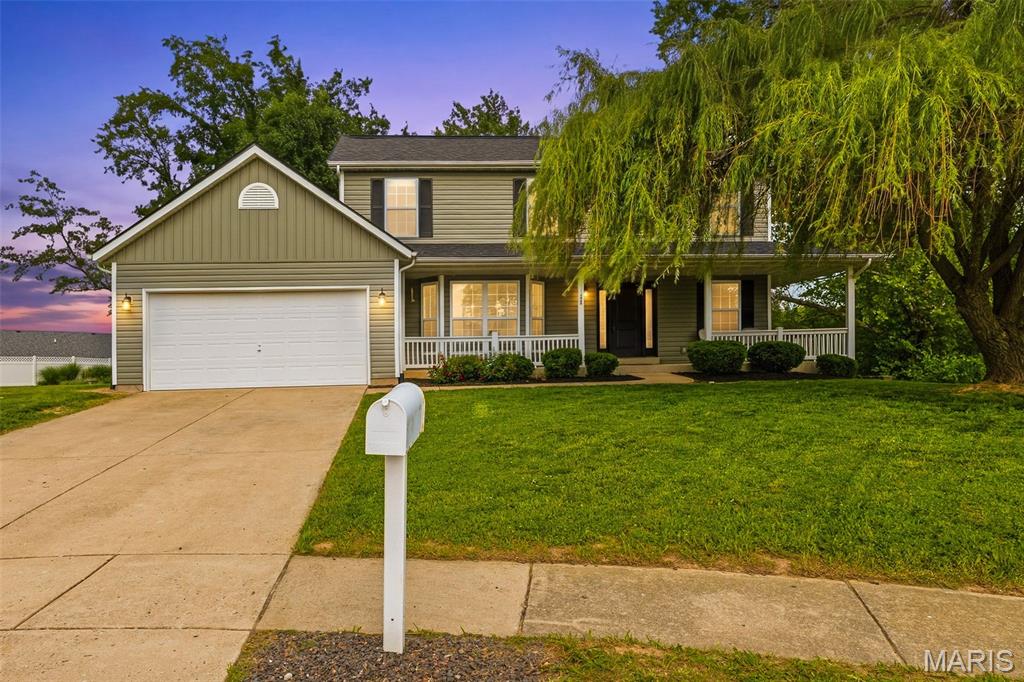 Situated on a cul-de-sac on the north end of Columbia, this charming 2-story home offers the perfect blend of comfort, functionality, and curb appeal—highlighted by a stunning wrap-around front porch that invites you to slow down and stay awhile. Inside, the main level is designed for everyday living and entertaining, featuring a versatile office with built-in desks (or ideal formal dining space), a cozy living room with a bay window and wood-burning fireplace, and a bright breakfast area just off the kitchen. The kitchen is equipped with stainless steel appliances, ample cabinetry, and a large pantry, while the main-level laundry adds convenience with an additional oversized pantry and nearby half bath.
Upstairs, the spacious primary suite offers a peaceful retreat with vaulted ceilings, a walk-in closet, and a charming nook perfect for a small office or sitting area. The en suite bath includes dual vanities, a soaking tub, and a separate shower. Two additional bedrooms and a full bath complete the upper level. The walk-out basement is ready for your vision, already featuring a rough-in for a future bathroom and the potential to expand your living and entertaining space.
Step outside to enjoy evenings on the large back deck overlooking the backyard. Additional highlights include a 2-car garage with an extended bay and major updates for peace of mind—new siding, roof, front windows, and downspouts all completed in 2026, plus a new hot water heater in December 2025. This home checks all the boxes in a sought-after Columbia location!