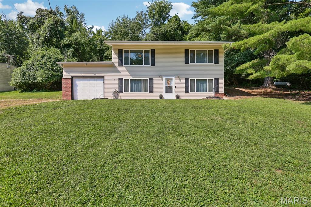 If you've been looking for a home that offers space, privacy, and the feeling of getting away from it all—while still having the comforts you want—this one deserves a closer look.

Nestled on a beautiful 2-acre corner lot, this inviting home offers a rare combination of wooded privacy and everyday convenience. The wooded backyard creates a peaceful natural setting where you can enjoy wildlife, mature trees, and the changing seasons right outside your door.

Outside the home is scheduled for a new roof! Garage Door has had new rolloers installed. Inside, the home has been refreshed with beautiful, newly Refinished Wood Floors, New carpet and fresh paint, creating a clean, welcoming backdrop that's ready for your personal style. The kitchen features stainless-steel appliances, while the spacious 3-bedroom, 1.5-bath layout offers ample space for everyday living, guests, a home office, or hobbies.

Step outside to your private back patio—a perfect spot for morning coffee, relaxing after a long day, entertaining friends, or simply enjoying the peaceful surroundings. For an added peace of mind, the seller is including a Home Warranty. This is the home you've been waiting for! Blocks away from shopping, restaurants, and gas stations.