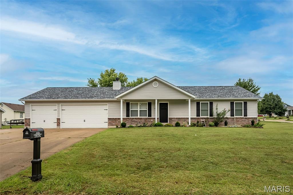 Beautifully updated and MOVE-IN-READY, this CORNER LOT ranch checks lots of boxes... Open concept living room/eat-in kitchen, recent appliance upgrades, LVP flooring THROUGHOUT THE MAIN FLOOR, updated light fixtures, and fresh paint!  The kitchen was well designed boasting Quartz countertops, soft close drawers, and a gorgeous tile backsplash.  The primary suite is spacious and offers 2 closets, one being a large walk-in.   The guest bath has been updated with  new lighting & paint, and don't miss the convenient MAIN FLOOR LAUNDRY.  The FULL, UNFINISHED basement is a blank slate for your imagination, with ample room to use for additional living space and storage.  Positioned on a huge lot, there is plenty of space for outdoor playing and gardening, as well as a 10X40 poured patio area.  This home comes equipped with a whole house fan, a reverse osmosis attachment in the kitchen, and an impressive PELICAN water softener system.  The 3 car garage is very deep and ready for your work bench, outside fridge, and lots of opportunities for storage too.  Don't overlook the additional parking pad ready for your boat or camper!  Roof replaced in 2022, water heater in 2020, and kitchen appliances in 2023.  Call your favorite realtor to schedule a time to view this well maintained home the The Legends Subdivison.