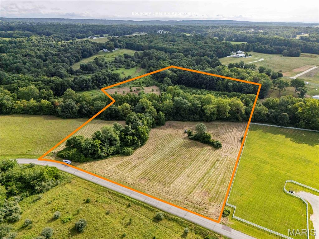 Excellent homesite and recreational land near Troy, MO! Water and electricity available on blacktop frontage.  Bobs Creek runs through the property, providing a scenic setting and water for wildlife or horses. Do not miss your opportunity to buy this beautiful property!