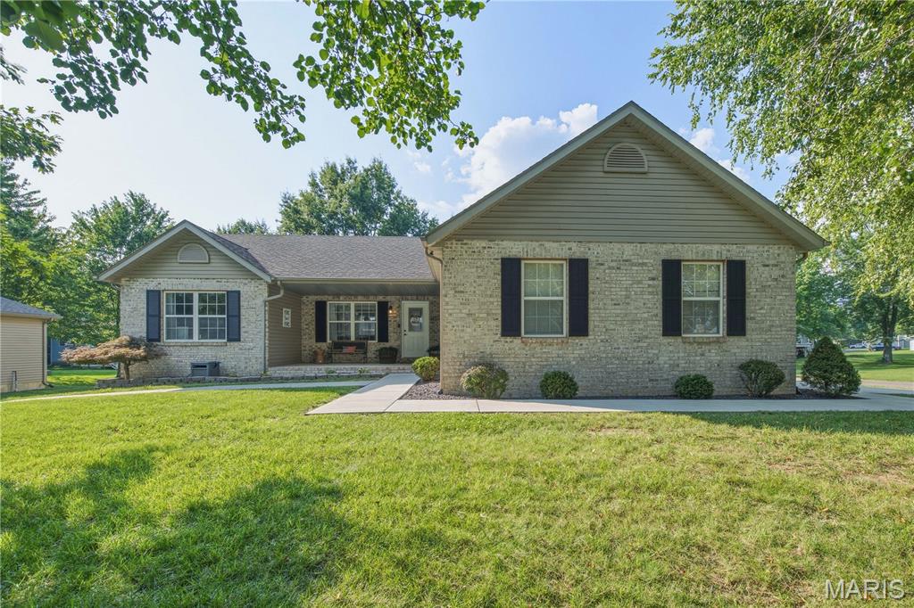 This stunning ranch home in Holiday Shores boasts a beautifully maintained interior and exterior. Inside, you'll find three bedrooms and three full bathrooms, with the convenience of a laundry room located on the main level. The kitchen has been recently updated, complete with modern appliances. The primary suite includes an ensuite bathroom and a large walk-in closet. Enjoy the cozy gas fireplace in the living room, perfect for relaxing evenings. The full, partially finished basement offers several storage rooms, a family room, and a full bath, with the potential to create an additional sleeping area if desired. Outside, the expansive back deck and welcoming front porch are perfect for entertaining. Situated on a .54 acre corner lot, there is ample space and privacy. Spacious 30'X36' detached garage w/electricity, ideal for extra storage and parking. The perfect place to store your boat, golf cart, lawn mower and there is even an extra parking pad with a 30 AMP RV/camper outlet. Holiday Shores is a vibrant community featuring a 430-acre man-made lake, ideal for water activities including boating and fishing. The community amenities include sandy beaches, a community clubhouse, a marina, pickleball, tennis, and basketball courts, as well as nearby restaurants and an ice cream/coffee shop. Schedule your showing today!