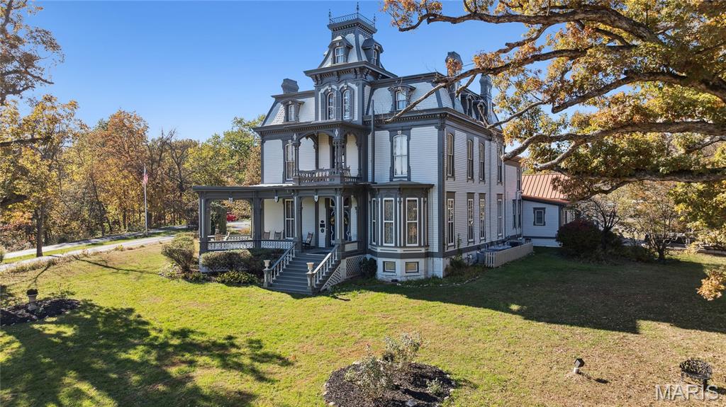 Come see this Landmark Estate, Bed and Breakfast, and Wedding Venue with cottages that has ties to Mark Twain. Step into over 150 years of American history at the Garth Woodside Mansion, an extraordinary 36-acre Victorian estate just outside historic downtown Hannibal. This is one of Hannibal’s most prominent properties with a historical tie to Samuel Clemens (better known as Mark Twain)—this mansion stands as both a testament to 19th-century craftsmanship and a cherished link to one of America’s greatest literary figures. Mark Twain was a frequent guest of the Garth family and often stayed in what is now known as the Mark Twain Room, where original furnishings from his visits remain. The Garths and the Clemens family shared a long personal friendship that began in Hannibal’s early river town days, and this home served as a quiet retreat for Twain during his returns to his beloved hometown. Owning this estate means preserving a piece of American literature’s living history—one of the few residences directly tied to Twain that remains privately owned. This Victorian mansion and additional cottages sit on approximately. 36 acres of manicured lawns, rolling pastures, and wooded privacy. This expansive 17 total-bedrooms on the property, most have a private ensuite bathrooms. The wrap-around veranda overlooking scenic Missouri countryside is exquisite. Original features include hand-carved walnut woodwork, marble fireplaces, original light fixtures, and most of the home’s original furnishings. Every room tells a story—from the grand staircase that has welcomed dignitaries and travelers for generations, to the Mark Twain Suite where guests still feel the echo of his wit and worldliness. The mansion’s architecture and furnishings remain remarkably authentic, while modern comforts have been seamlessly integrated. Garth Woodside Mansion is not just a home—it’s a living chapter of American history, where every detail whispers the story of friendship, craftsmanship, and literary legacy. Long operated as a high-end bed & breakfast and wedding venue with additional cottages, the Garth Woodside Mansion has earned consistent acclaim for its historic charm, fine dining experiences, and quiet elegance. This is a turn-key hospitality business opportunity with international name recognition. The property could easily transition into a private residence, corporate retreat, family compound, or heritage investment property. This is a rare offering for private ownership —heritage of this caliber seldom becomes available with the additional income from the cottages as well. Serious and qualified buyers are invited to request private showings and access to records, revenue details, and preservation available on request.