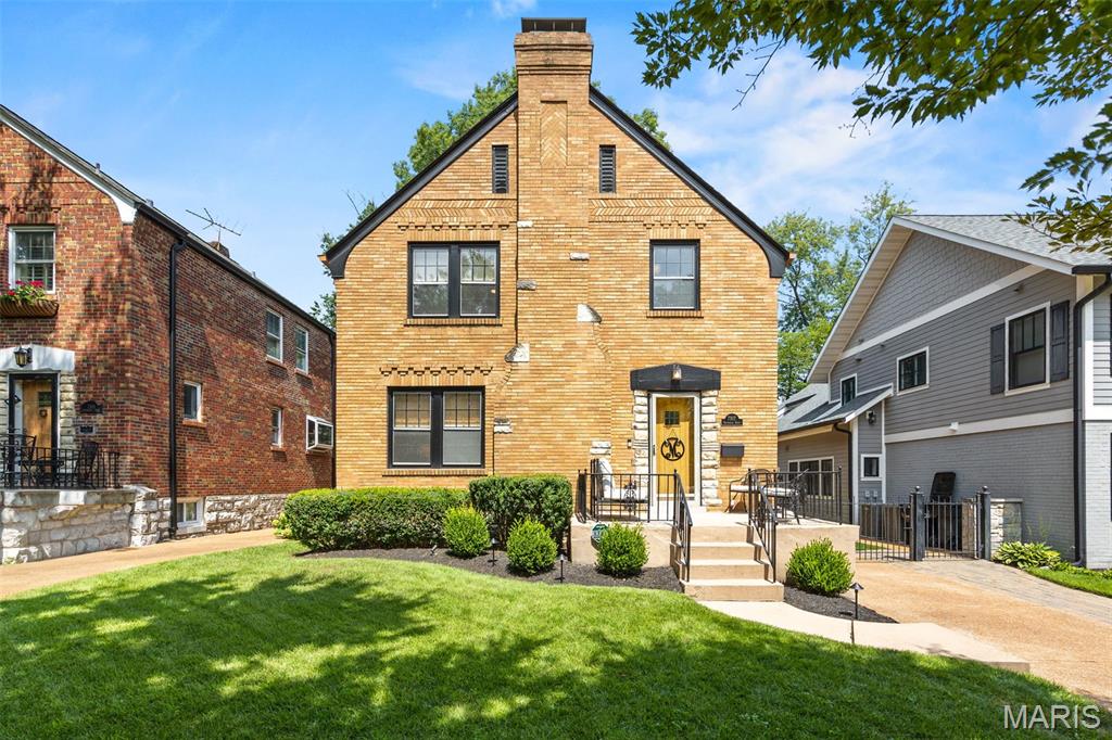 Welcome to this lovely storybook home situated in a desirable University City neighborhood. This brick charmer immediately catches your attention, with its inviting front porch and beautiful curb appeal. Step inside and you’ll immediately notice the hardwood floors, beautiful millwork, and impeccable condition.

The spacious living room is the perfect place to catch up on your favorite shows or cozy up with a good book. Just beyond is the stunning dining room, once again showcasing the character and charm found throughout the home. The stylish kitchen is equally impressive, along with an updated powder room conveniently located on the main floor.

Upstairs, you’ll find three bedrooms, all with outfitted closets and plenty of space, along with a beautifully designed full bath. The primary is spacious and has portrait molding, adding more personality to the already pretty space.

The lower level offers a finished recreation/office area, plus clean and tidy unfinished storage space with laundry. A walk-up leads directly to the 1+ car garage, making it incredibly convenient to bring home bulky items and tuck them away in storage.

And then there’s the fenced-in yard—it’s perfection! Beautiful green space, lovely gardens, and a patio create the perfect setting for relaxing, entertaining, and enjoying the outdoors.

It doesn’t get much better than this! Enjoy!