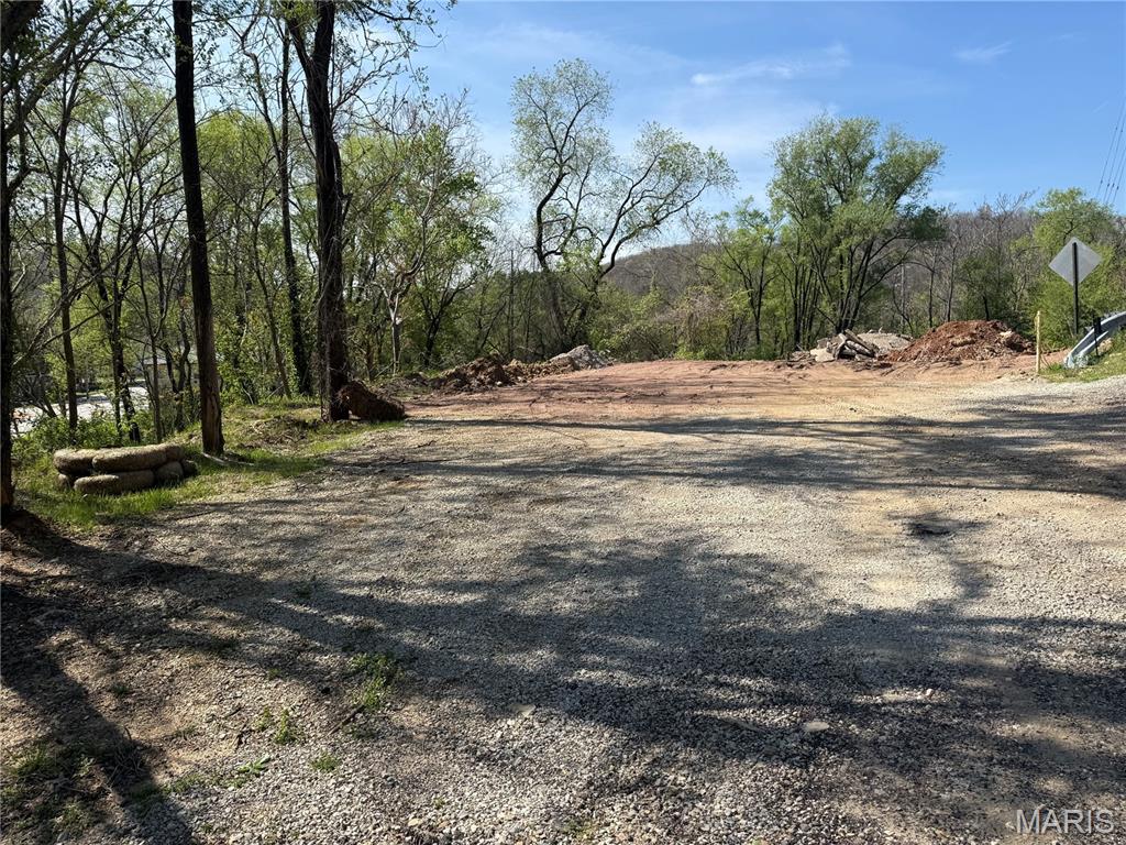 Half acre vacant lot in House Springs just minutes from Gravois Rd and Main St. Close to shopping and restaurants! Some trees have been cleared making room for your future plans. A new public sewer system is being installed near by as well! This lot is zoned residential, R-10. See attachments for permitted zoning uses.