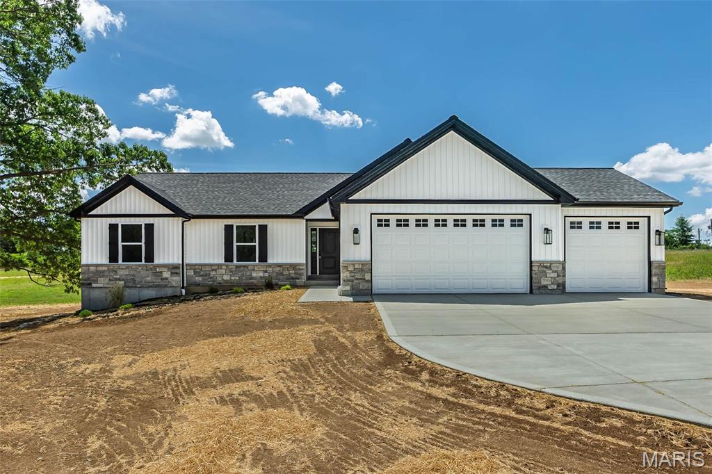 Completed Builder Spec Home on 10 Acres with an Oversized 3-Car Garage, Cul-de-Sac Location, Minimal Restrictions & Horses Allowed in Oakview Meadows Subdivision! This 3 BR, 2 BA ranch offers 1,564 sq ft of thoughtfully designed living space, acreage, and an impressive oversized 3-car garage. The open floor plan features vaulted ceilings and durable laminate flooring flowing through the foyer, great room, kitchen, breakfast area, and main floor laundry, creating a bright and inviting living space. The kitchen is designed for both everyday living and entertaining, featuring upgraded cabinetry w/ crown molding, a center island, quartz countertops, SS appliance package, and cabinet hardware. The primary suite offers a comfortable retreat with a private BA, adult-height vanity, LVT flooring, tile shower, and semi-frameless shower door. Two additional BRs with carpet flooring and a full hall BA provide flexible space for family, guests, or a home office. One of the home's standout features is the massive extended 3-car garage, measuring approx. 34' x 25', with one bay extending to approx. 30' deep. With 8' garage doors and exceptional clearance and depth, there is plenty of room for full-size extended-cab trucks, larger vehicles, additional storage, workshop space, or hobbies. Additional features include an upgraded lighting package, ceiling fan locations, modern trim and door package, laminate flooring throughout the main living areas, LVT flooring in the BAs, and carpeted BRs for added comfort. Situated on 10 acres on your own cul-de-sac, this property offers the space and peaceful surroundings you have been looking for while still providing convenient access to schools, parks, shopping, dining, and everyday amenities in Troy.