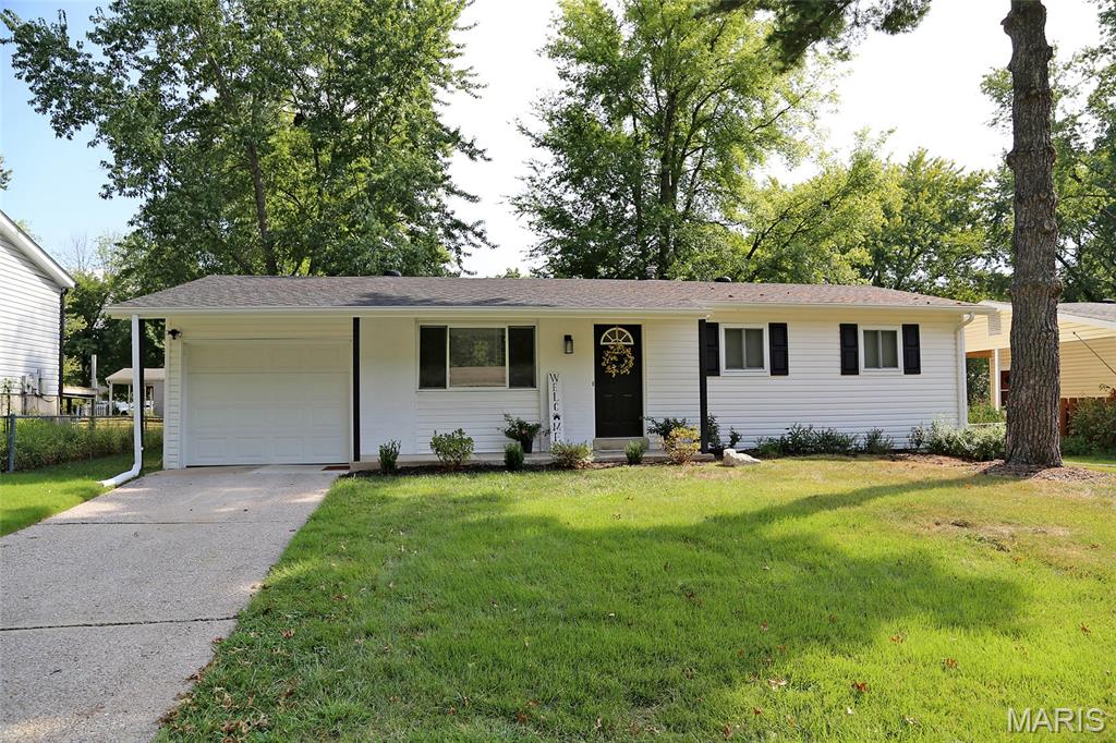 TOTALLY UPDATED 3BR RANCH--LIKE A NEW HOME! All Updates completed in last Two years. Enter off covered porch through newer front door into living room w/wood floors, large picture window, & recessed lighting. Kitchen w/breakfast room is adjacent with stainless steel appliances, white shaker cabinets, granite counters w/undermount stainless steel sink, & rectangular tile flooring. Three bedrooms, all with wood floors & ceiling fans. Full hall bath with newer vanity, toilet, tile tub surround, lighting & mirror. Lower level has been beautifully professionally finished & provides 500+ additional square feet of living plus a 20x12 storage area/utility room. Back yard is large, level, partially fenced, shaded with trees, with a 13x13 concrete patio. Attached garage with garage door. Two year old roof, vinyl siding,  windows, Two year old hot water heater, lighting, enclosed soffit & fascia. Freshly painted throughout.