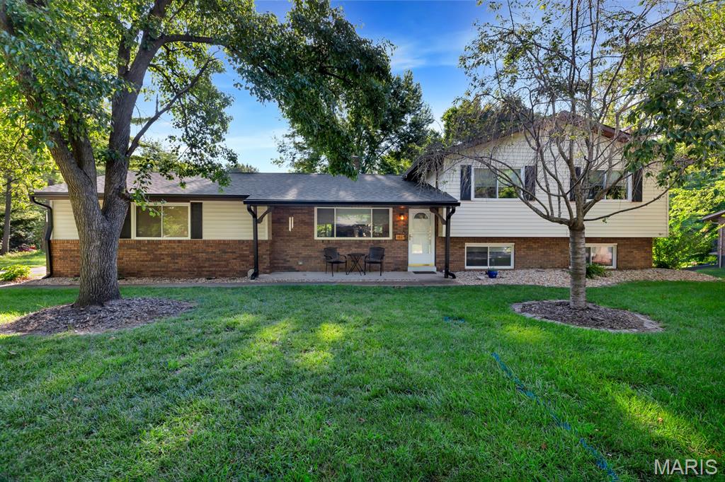 MOVE IN CONDITION - QUAD-LEVEL HOME IN GLENWOOD ESTATES SUBDIVISION!  The main level offers an inviting living room featuring a beautiful brick double sided gas fireplace. Spacious kitchen has an abundance of white cabinets and counters, large breakfast bar and new stainless appliances. The upper level offers a primary bedroom with private bath and double closet. 2 additional roomy bedrooms, plus full hall bath. Lower level with enormous family room with yet another brick fireplace - this one is wood burning.  At the other end is a great space for dining, snack space or game area. 4th bedroom and combo 1/2 bath - laundry room complete the lower level. However, that's not it - one more level, unfinished basement is perfect for storage, workout area, or potential for future square footage. Let's step outside to the private backyard - completely fenced. The property behind this home is privately owned. It's the perfect place to kick back and relax in the brand new 24' round above ground pool (2026). The huge deck and fire pit area is a great gathering space for family and friends. Rear entry oversized 2 car attached garage. Lots of updates - architectural shingles in 2024 - new stainless kitchen appliances - keyless entry - resealed driveway - several rooms freshly painted - new Rinnai tankless hot water heater - smart wifi enables garage door openers - new carpet in lower bedroom. Great access to 270 and 255, shopping, dining, and the SIUE campus. Just move in and call it HOME! Buyers to verify all MLS data, including but not limited to, square footage, measurements, taxes, exemptions, lot size, etc.