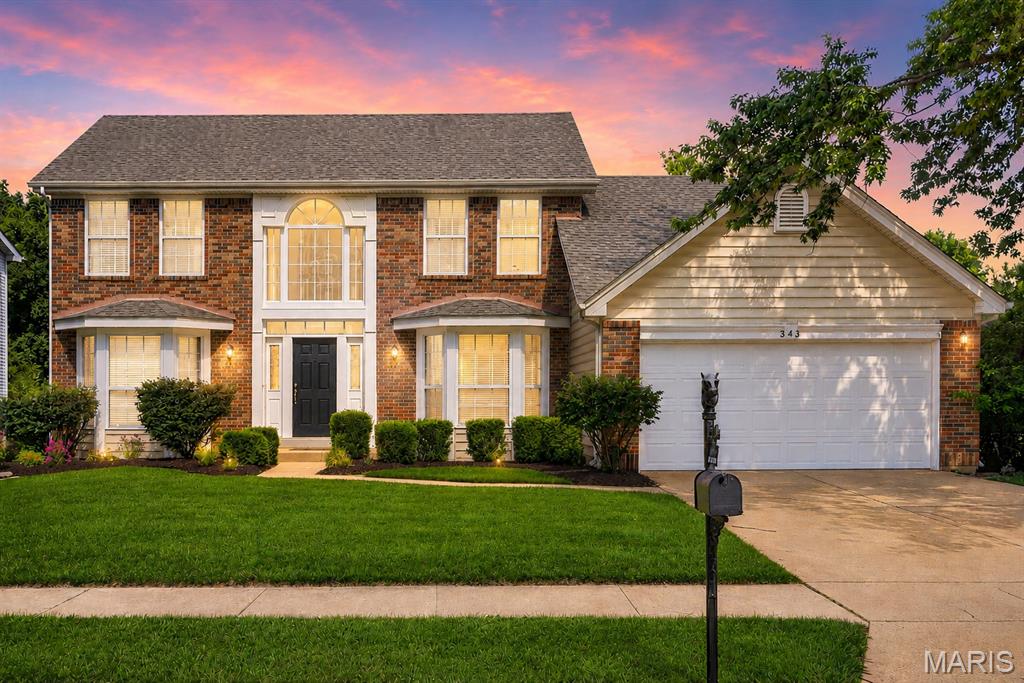 Beautiful Wildwood 2 story home in a great neighborhood awaits you! 340 Copper Lakes offers 3 bedrooms, 2.5 bathrooms, and on a fantastic corner lot. As you enter the home you'll be greeted by the two story foyer, big picture window and modern chandelier. At the front of the home you'll find a living room/office, and dining room off the kitchen complimented by crown molding, bay windows, modern lighting, and wainscoting details. The large family room is surrounded by windows adding loads of natural light. A cozy wood burning fireplace, and a wet bar makes this the perfect place to spend quality time together. The updated kitchen offers custom cabinets, granite countertops, stainless steel appliances, modern lighting, and a pantry. Rounding out the main floor is a half bathroom, main floor laundry, access to the patio, and two car garage. Upstairs you'll find two generous sized bedrooms and a hall full bath with updated mirrors and lighting. The spacious master suite offers vaulted ceilings, large walk in closet, and large private bathroom with double sinks, soaking tub, and shower, updated mirrors, lighting, and hardware. The finished lower level is a fantastic bonus space for extra living room, office, kids play room, or sleeping area. Great amount of storage space as well as an entire new HVAC system! Last but not least is the fabulous back yard! Level and low maintenance yard, good sized patio, string lights, and a hot tub! Enjoy endless summer nights entertaining or spending quality time with family! Don't sleep on this charming, updated, and well taken care of two story home in a great neighborhood and great city!