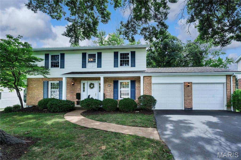 Wonderful 4-bedroom, 2.5-bath 2-story home with great curb appeal in A-rated Parkway School District and popular, established Wild Wood Subdivision!  Over 2,600 SF of finished living space! Spacious bedrooms with wood floors, large eat-in kitchen with 42-inch white cabinetry, formal dining room with picture frame wainscoting and chair rail, chandelier, family room with gas log fireplace walks out to newly painted deck with steps to yard that backs to woods; primary bedroom suite with walk-in closet and 3 additional bedroom upstairs, with large hall bath and jet tub; huge finished walk-out lower level with rec. room; 2-car attached garage, nice shade trees.  TERRIFIC location close to all that Manchester Road has to offer, just a short drive to Chesterfield Valley, and walk to nearby restaurants, banks, shops, hardware store, etc.  Make an appointment to tour today - you'll be glad you did!
