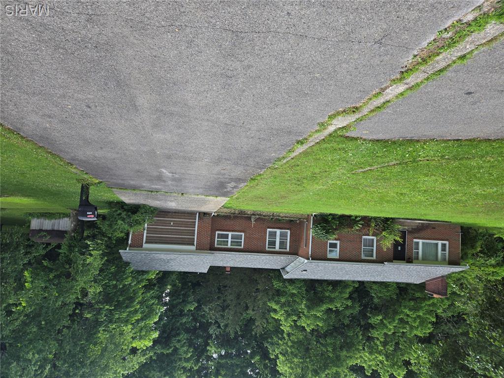 Great house which needs some fixing-up. Well built brick home, on  0.83 acre, (2 lots) Private back porch. Large 2 bedroom home. New roof 5 years ago. Owner inherited this property from parents.  Well is on this property.  Seller has had her attorney prepare agreement that Seller will still be allowed to use this well as a shared well. Buyers may see this agreement by attorney, upon request.  Also see copy of survey.