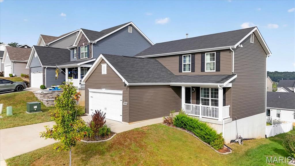This almost new Berwick home is two stories of fabulous! Upstairs is where you will find the master suite with a walk in closet, adult height vanity, double sinks, walk-in shower, linen closet and large window and level 3 Avalon Sarsaparilla bathroom cabinetry. There is also 2 additional bedrooms, another full bathroom and the laundry room - making this layout very convenient! The main level has a spacious family room, half bath off of the 2 car garage, open kitchen layout with lots of countertop space, extensive cabinetry, stainless steel GE appliances, 42” tall cabinetry, a center kitchen island with an extended countertop, a connected dining area, a nice size pantry, a long coat closet and more storage, and appliances can stay! The unfinished basement is ideal for all your Pinterest ideas and final touches with a rough in for a bathroom already included! With all that this home has to offer, beautiful wood laminate flooring featured throughout the main level and a fenced in back yard, this popular floor plan is perfect for entertaining! Your Fenton home is minutes from Gravois Bluffs! The community includes 47 acres of common ground, rolling hills, beautiful views, sidewalks and lush trees. Make an appointment today and start enjoying the benefits of a newer construction home without the wait!