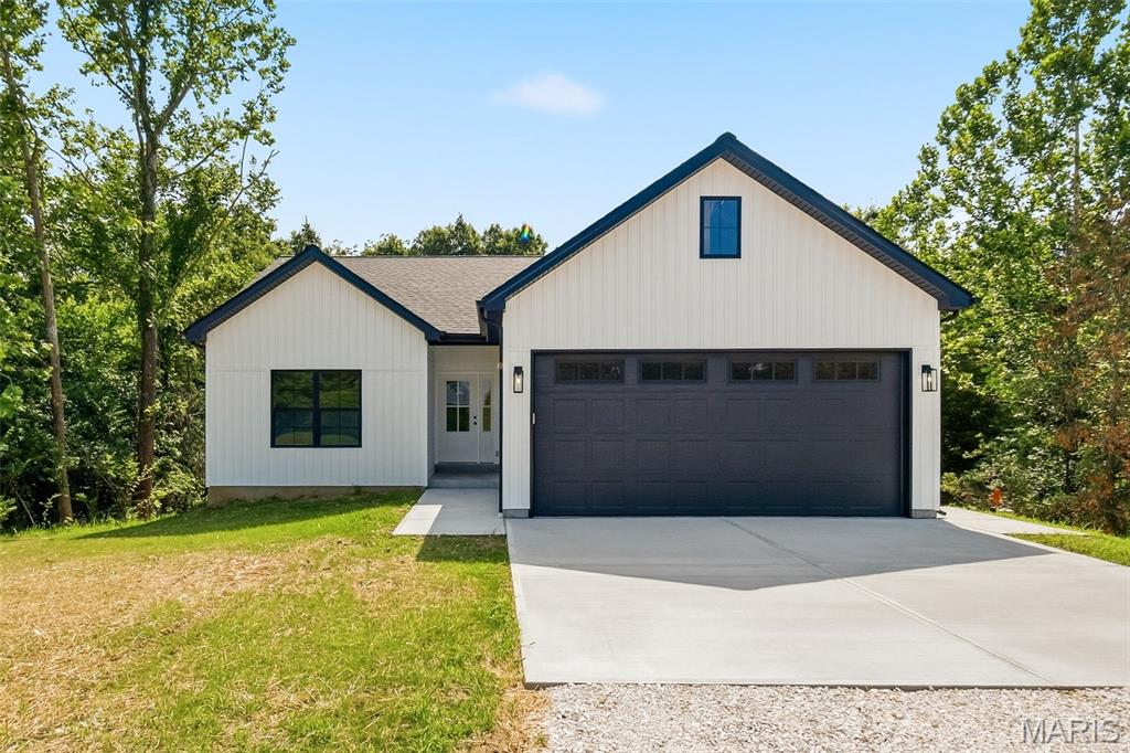 **No HOA, minimal restrictions, and 3 beautiful acres**—a combination that's becoming increasingly difficult to find! Enjoy the freedom to build a shop, park your RV or boat, and truly make your property your own without the limitations of a neighborhood association.

Welcome home to this beautifully crafted new construction home nestled on 3 scenic acres in Winfield! Offering 3 bedrooms and 2 bathrooms, this thoughtfully designed home combines modern comfort with peaceful country living. Enjoy stunning finishes throughout, including an open-concept floor plan, stylish kitchen, spacious living areas, and a private primary suite.

Step outside and take in the tranquil setting with mature trees lining the backyard, providing both privacy and picturesque views. Whether you're relaxing on the patio or entertaining family and friends, you'll love the serene surroundings and quality craftsmanship this home has to offer. Experience the perfect blend of country charm and modern elegance while still being just minutes from town. If you've been searching for acreage, privacy, and the freedom to enjoy your property the way you want, this exceptional home is one you won't want to miss.