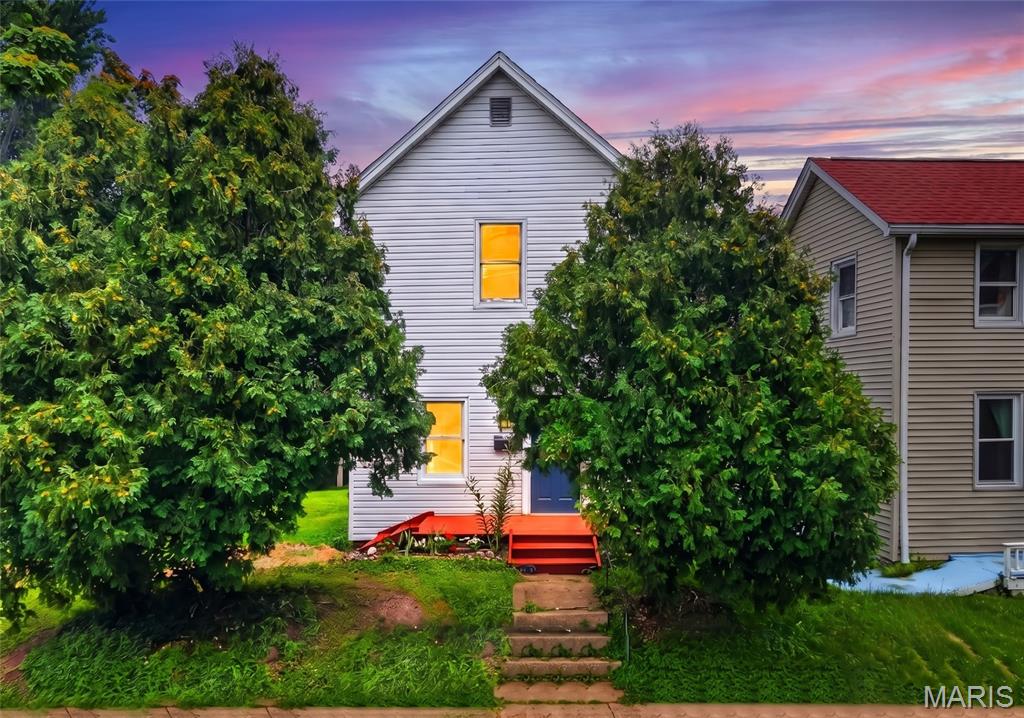 This is a dream opportunity that only comes around once in a blue moon! Tucked only one street away from historic Dogtown's famous St. Patrick's Day Parade route, this adorable 2-bed, 1-bath home offers unmatched potential for city living and community! The vision begins chock-full of curb appeal with a well-maintained garden and freshly stained wood porch. Inside feels open and bright with tons of windows, high ceilings, and wood floors that continue through the home! The large kitchen is one-of-a-kind with custom white cabinetry, tiled counters, wood paneling, and white appliances! A perfect place for your friends to gather! Upstairs, two spacious bedrooms offer the perfect solutions for rest or even a work-from-home office. The bathroom completes the second level! This home boasts two amazing options for your own unique finishes! The attic is ready to be your private reading nook or hobby area! The basement is ready to become your home theater or game room. Endless possibilities! The backyard is a rare gem in the city featuring mature trees and tons of space for end of summer BBQs or a relaxing firepit! This home has been recently updated with a new roof and gutters! Minutes away from local features like St. James the Greater Parish plus some of the areas best shopping, dining, and other attractions! The opportunity gets even better with the rare chance of owning a double lot in Dogtown! This could be the prime chance to add additional parking, expand your lot for unheard of private space, or develop further for extra financial gains. See MLS #26046749 (second lot not included in purchase of house). Don't miss out on making this Dogtown gem YOURS! Schedule your private showing today!