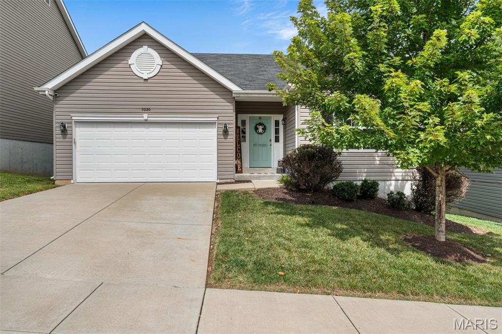 Welcome home to this beautifully upgraded 4-bedroom, 3-bath ranch, ideally situated on a cul-de-sac street in Eureka and the highly sought-after Rockwood School District! From the moment you step inside, you’ll love the open floor plan and custom details throughout. The main level features luxury vinyl plank flooring throughout most of the living space, 42” custom kitchen cabinetry, a wood-burning fireplace with shiplap accent, board & batten wainscoting in the entry way,  farmhouse crown molding, 5 1/4” baseboards, recessed lighting with Halo features, and a custom rustic stair banister. The primary bath features new ceramic tile flooring. Step outside to the 16x12 composite deck overlooking a level, fenced backyard backing to wooded common ground for added privacy. The finished walkout lower level offers even more living space with a spacious rec room, bar area, 4th bedroom, and 3rd full bath—perfect for guests, entertaining, or additional living space. Additional updates include new carpet in 2022, and dishwasher in 2025. Don’t miss the heated garage with its own sub-panel. Upgrades galore, incredible indoor and outdoor living space, a private setting, and a fantastic cul-de-sac location make this Eureka ranch one you won’t want to miss!