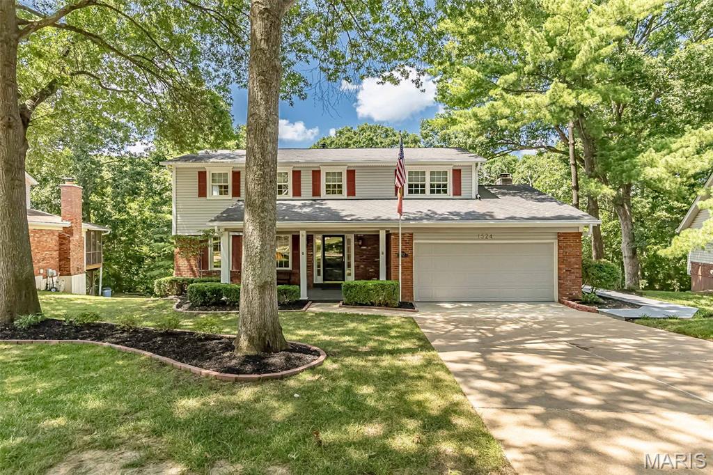 Welcome to 1524 Pheasant Ridge, a stunning, move-in-ready 4-bedroom, 2.5-bathroom home nestled on a quiet private street in the heart of Ellisville, within the top-rated Rockwood School District. Beautiful Pergo Laminate Wood flooring flows throughout most of the main living areas and spacious bedrooms, anchoring an inviting floor plan highlighted by an updated kitchen with crisp white cabinetry and a cozy family room featuring a gas fireplace. Off the main area, a light-filled four-seasons room opens directly to a no-maintenance wraparound deck and newly updated landscaping—perfect for relaxing or entertaining with tranquil tree-backed privacy. Upstairs, you'll find four large bedrooms and stylishly updated baths, including a primary suite with private amenities. The bright, walk-out lower level offers flexible space for a home gym, second family room, or media center with easy backyard access. Complete with a 2-car garage, an irrigation sprinkler system, and a brand-new HVAC system (2024), this exceptional home offers ultimate comfort just minutes from local parks, shopping, and dining. Come see!! Seller to credit buyer at closing $5,000 for counter tops.
