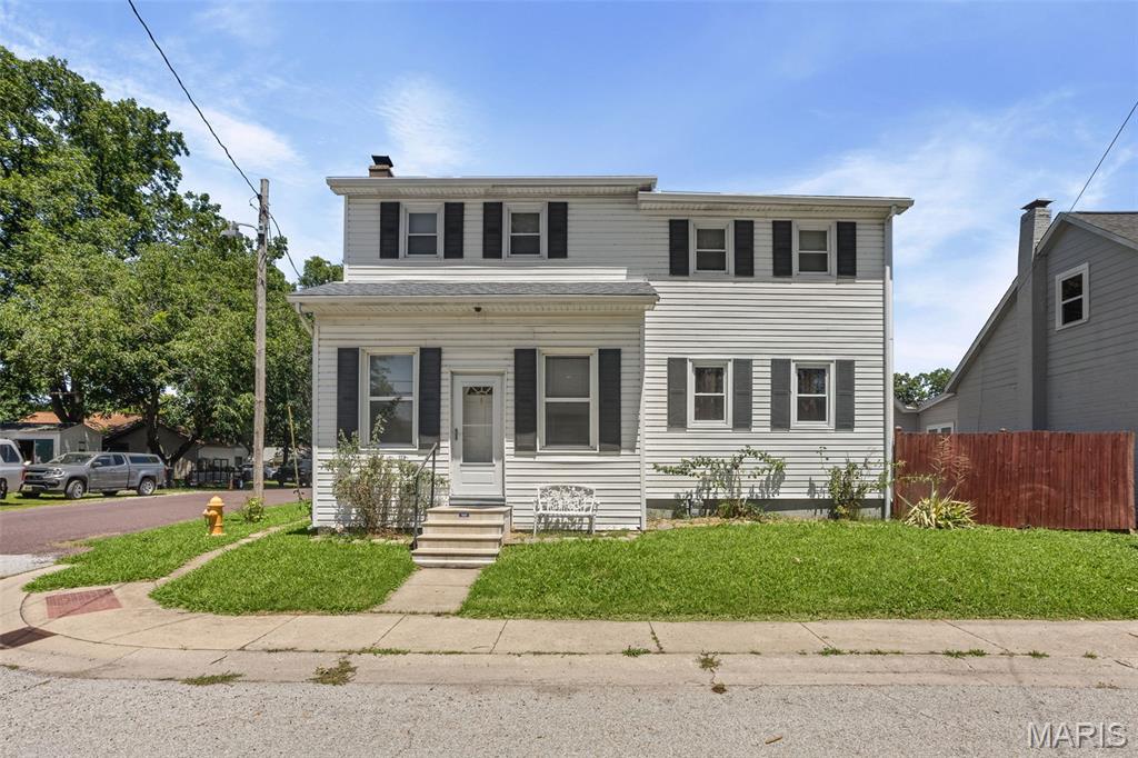 Situated on a corner lot in the heart of Mascoutah, this home has been well maintained & is ready for a new owner! Main floor primary bedroom, updated full bath. Large living room. Kitchen has ample cabinetry, pantry & stainless steel appliances stay. The main floor laundry & half bath are so convenient! Upper level has new paint, bedrooms 2 & 3, bonus room that could be used as an office or potential 4th bedroom, plus a 2nd full bath. All bedrooms have new carpet! Storage room located off of kitchen has access to partial, unfinished basement. Furnace, A/C and water heater - 2021. Mostly newer windows. Shed included. Partially fenced. 2-Car oversized detached garage built in 1994, is heated, includes mud sink (with cold water only) & has insulated garage doors! Home will pass city occupancy inspection. Buyer to verify all information.