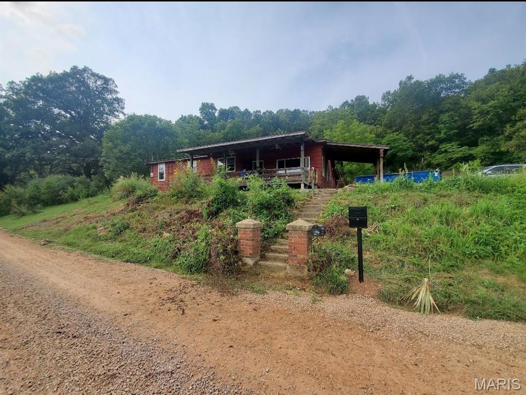 Discover endless possibilities with this exceptional 157+- acre property, offering the perfect combination of investment potential, recreational appeal, and country living.

The land features a diverse mix of open fields and natural terrain, ideal for farming, hunting, or future development. A beautiful year-round creek winds through the property, enhancing both its scenic charm and wildlife habitat—making it especially attractive for deer and turkey hunting enthusiasts.

Improvements include a barn and a spacious shop, providing ample storage for equipment, tools, and recreational vehicles. The existing home has been fully gutted, giving you a blank canvas to create your dream residence, hunting cabin, or income-producing property.

With county road frontage and convenient access just minutes from Highway 67, the property offers both privacy and accessibility—an excellent combination for personal use or long-term investment. Its proximity to Sam A. Baker State Park, the St. Francis River, and Lake Wappapella adds even more value, with abundant opportunities for fishing, floating, hiking, and outdoor adventure nearby.

Whether you're searching for a private retreat, working farm, hunting property, or development opportunity, this versatile tract is ready to meet your vision.