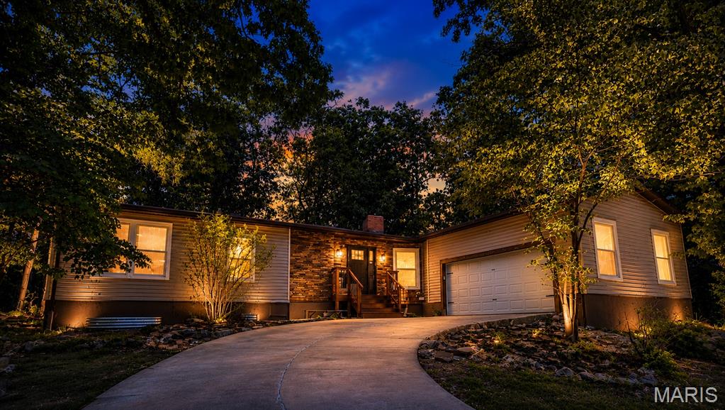 Tucked away at the end of a quiet cul-de-sac in a gated community, this charming mid-century modern home blends character and comfort.
Inside, a seamless kitchen and dining area flows into a distinctive step-down living room, anchored by a stunning double-sided fireplace—perfect for everyday living and entertaining. The kitchen features a walk-in pantry, while the spacious primary suite offers a large walk-in closet.
Enjoy extra flexibility with a partially finished basement and additional storage. Set on a partially wooded lot, this home offers privacy alongside desirable community amenities including 6 lakes, a pool, marina, and much more.