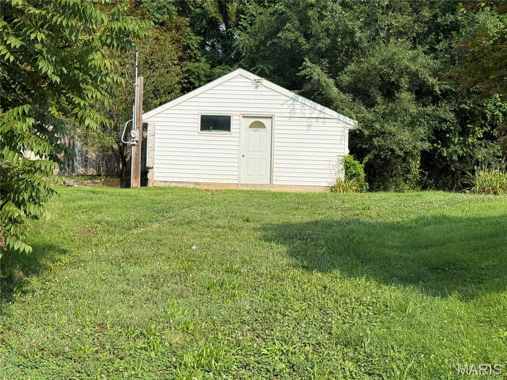 Large corner lot including 401 Fulton and 405-409 Fulton, all being sold together as is. Located under Lover's Leap right in historic Hannibal. Has commercial zoning so perfect lot to put your business on. The shed has plumbing and electric already, could be finished off if you want to start a small business inside or even turn into a mini house. This property also has some of the best firework views in Hannibal on the Fourth of July sitting right below lover's leap. In the back half of this lot is even a small cave. This piece offers much potential for someone looking to invest.