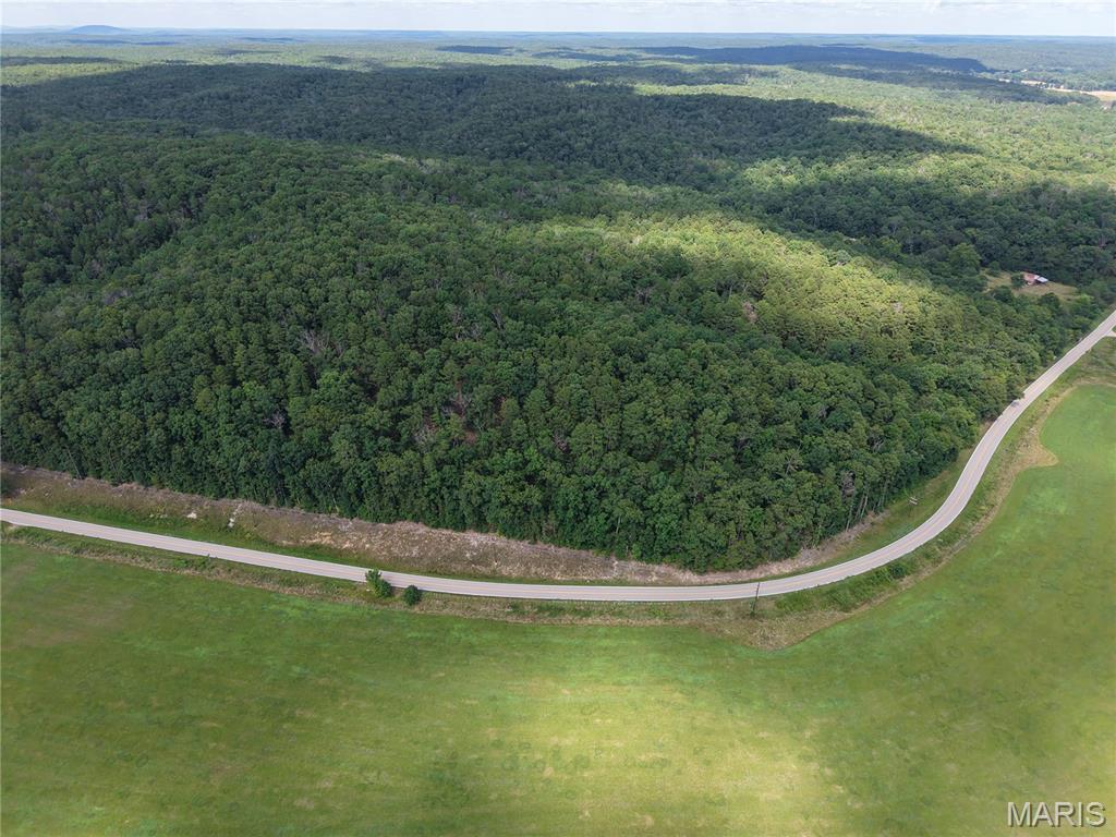 Opportunities like this don’t come around often. This 49.52-acre tract in Wayne County, Missouri offers a rare combination of history, privacy, and outdoor recreation. A historic one-room schoolhouse serves as a unique centerpiece, while the barn, pond, wet-weather creek, and established trail system add to the property’s charm and usability. Multiple beautiful building sites make it easy to envision your dream home or weekend getaway. Electricity is available, and a hand-dug well is already on the property. Best of all, the back of the property borders public land, giving you direct access to additional acreage for hunting, hiking, and exploring. Whether you’re searching for a homesite, recreational property, or an investment in the Ozarks, this one is ready to be enjoyed.

Agent Owned