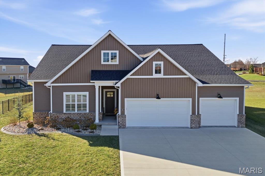 Designed for comfortable modern living, this beautifully appointed home offers a spacious open-concept layout that seamlessly blends style and functionality. The inviting living room features a gas fireplace and wood beam accents and flows effortlessly into the gourmet kitchen—ideal for everyday living and entertaining. The kitchen boasts quartz countertops, high-end appliances, a center island, gas range with vent hood, and a walk-in pantry. The primary suite provides a private retreat with a walk-in closet and an en-suite bath featuring a double vanity and tiled shower. Secondary bedrooms are generously sized. The finished lower level adds valuable living space with a large family room, fourth bedroom, full bath, and ample storage. Conveniently located near interstates, shopping, dining, and Scott AFB.