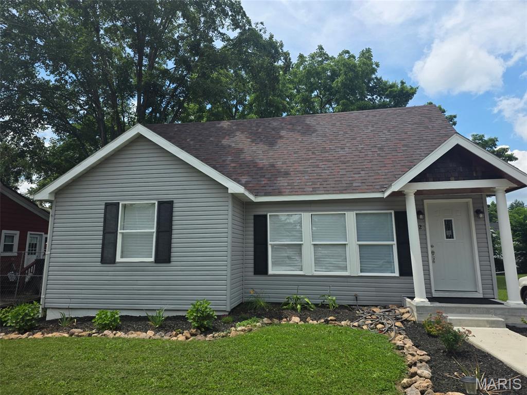 Completely remodeled from top to bottom, this spacious 5-bedroom, 2 bath home blends modern comfort with timeless character. The generous primary suite features an en-suite bath with a walk-in shower and his/hers closets, offering a true retreat. Enjoy peace of mind with all-new electric and sub panel, new plumbing, and a brand-new roof. Brand new HVAC. A new sidewalk leads you to the charming front porch, welcoming you into a fully updated interior. The beautifully remodeled eat-in kitchen includes new cabinets, countertops, and appliances, making it the perfect space for everyday living or hosting guests. Restored hardwood floors flow through half of the home and the upper level, complimented by luxury vinyl plank in the remaining rooms for durability and style. Convenience continues with a main floor laundry featuring a utility sink. Mudroom on the back of the house with direct access to the brand-new large back deck-ideal for relaxing or entertaining. This home truly offers the feeling of "new construction" with the charm of an established neighborhood. Move-in ready and designed for today's lifestyle.