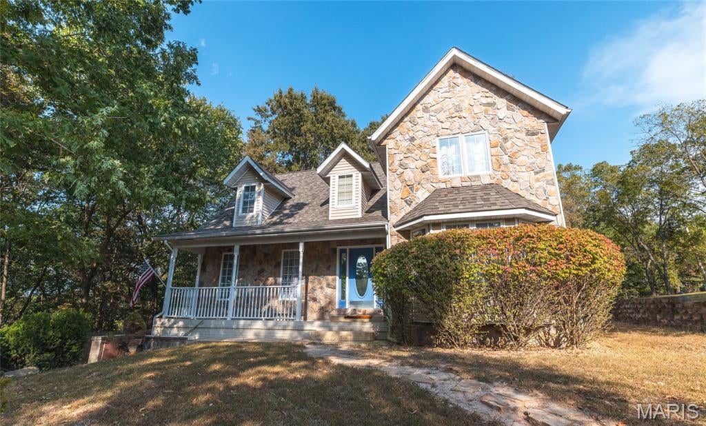 Tucked away at the end of a quiet cul-de-sac, this spacious 4-bedroom, 3.5-bath home offers a peaceful retreat surrounded by mature trees and abundant wildlife—some of which may even stop by the front door for a treat! Conveniently located near Fort Leonard Wood, this home also qualifies for VA financing. Inside, the main level is designed for comfortable everyday living. The kitchen features an eat-in dining area, electric cooktop, wall oven, tiled backsplash, and convenient access to the spacious rear deck. The living room and half bath are also located on the main floor, along with the private Owner’s Suite. Bay windows fill the suite with natural light, while two cedar-lined walk-in closets provide generous storage. The ensuite bath offers a relaxing corner soaking tub. Upstairs, you’ll find three additional bedrooms and a shared full bathroom, providing plenty of space for family, guests, or a home office. The finished walk-out basement expands your living options with additional gathering space, a full bathroom, and flexible room for recreation or hobbies. Outside, enjoy the wooded setting from the spacious deck or gather around the fire pit. Dual heating and air systems provide year-round comfort, and a new roof was installed in December 2025. Schedule your private showing today and discover the space, privacy, and convenient location this home has to offer!