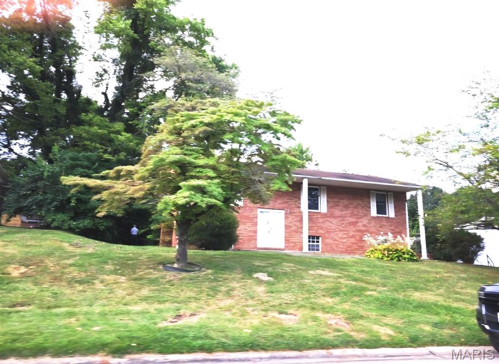 Split level home with an attached two car garage with so much to offer! Upper level has three bedrooms, 2 bathrooms, living room, kitchen and dining room. Primary bedroom has en-suite with a shower. Lower level has family room with fireplace, sitting area, half bathroom and utility room. Oversized storage area for work space in the side entry and two car garage. Bring your imagination and creativity to make this your home.  Conveniently located close to Edwardsville, parks,  walking/biking trails, local amenities, and schools. This property is a fantastic opportunity for investors and home owners alike. Home is being sold as-is. Set your appointment today, Buyer to verify square footage, schools and details.