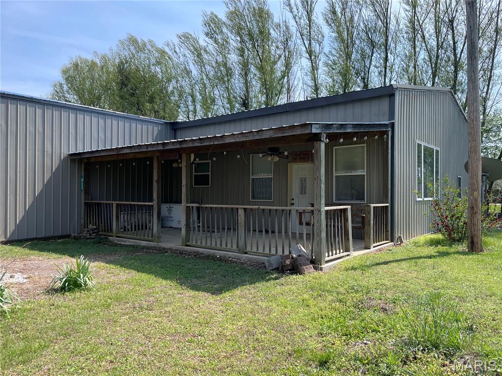 Great location in town but off the beaten path. Metal sided shop house with attached storage area, workshop and massive 32 x 52 garage. House gives off cabin vibes with vaulted ceilinged living room, separate kitchen and dining room, 2-bedrooms, 2-baths, large laundry room and upstairs bonus room. Cozy car siding, dark wood accents and tin ceilings add to the charm. Covered front porch for evening entertaining. There's so much room for side x sides, 4-wheelers, campers and all the supplies you need for a weekend of fun. Explore numerous hiking and biking trails, Clearwater Lake, Sam A. Baker and Black River.