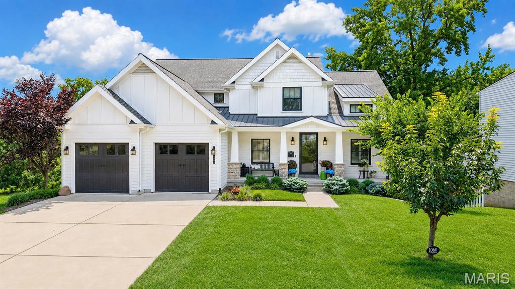 Move-in ready and thoughtfully designed, this exceptional 9-year-old custom Craftsman-style 1.5-story home blends timeless architecture with modern luxury. Rich job-finished hardwood floors flow throughout the main level, leading to a stunning chef's kitchen with shaker-style cabinetry, quartz countertops, a center island, and a butler's pantry/wet bar with wine refrigerator. The kitchen opens seamlessly to the breakfast and hearth room featuring a gas fireplace with stone surround, creating the perfect gathering space. The spacious main-floor primary suite offers a vaulted ceiling and two custom walk-in closets by St. Louis Closet Company and luxurious bath. Upstairs, you'll find three spacious bedrooms, two full baths, a versatile bonus room, and a convenient second laundry. The finished walk-out lower level is ideal for entertaining with a family room, mini-kitchen/bar area, gym, fifth bedroom, full bath, and direct access to the backyard oasis. Enjoy outdoor living on the covered composite deck with solar shades overlooking the sparkling pool. Additional highlights include Hardie Board siding, plantation shutters, oversized epoxy-floor garage, central vacuum, security system with six exterior cameras, zoned HVAC and much more.  Ideally located in the heart of Glendale, this beautifully crafted home offers exceptional quality, comfort, and style.