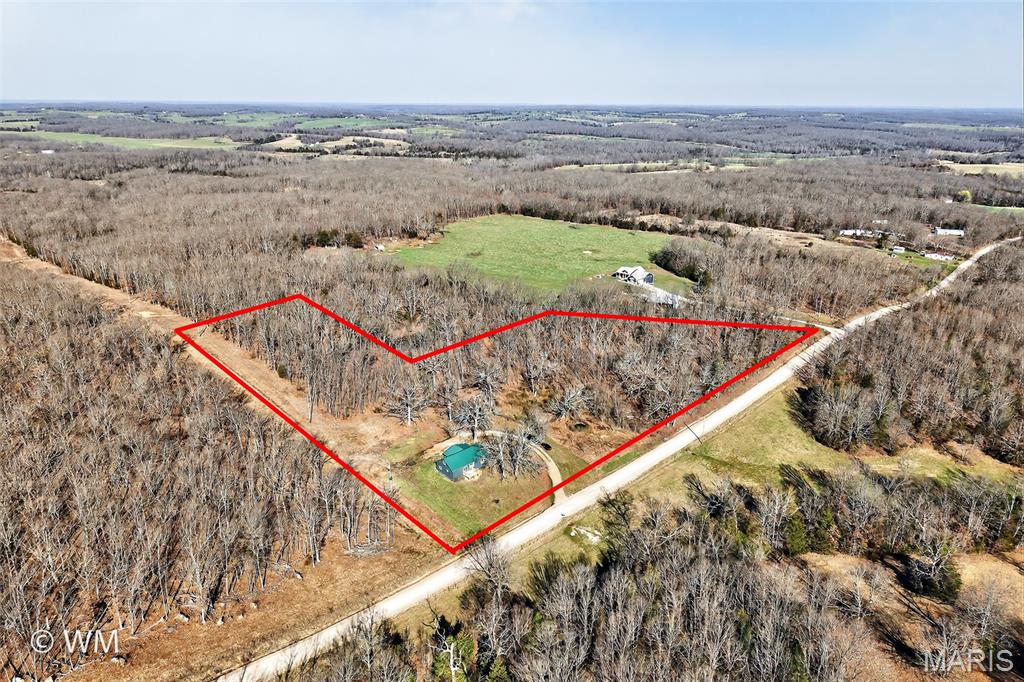 No neighbors in sight, 5 private acres, and a updated 5 bedroom/2 bathroom with bonus room home with High School options of Waynesville, Crocker or Richland! This is the kind of country property buyers wait for. With mostly fenced acreage, a livestock shed, and space for gardening, animals, or hobby farming, this property offers the freedom and privacy many buyers are searching for.

Recent improvements include new flooring throughout the entire home, fresh paint, new light fixtures, new stainless steel Whirlpool appliances, a new kitchen sink, several new windows, and a completely remodeled primary suite bathroom. Step outside onto the brand new deck, perfect for relaxing or grilling, the front entry is fully covered concrete patio so you can enjoy the peaceful views of the surrounding property.

The home features a large open layout with 3 bedrooms and 2 bathrooms on the main level, along with main-level laundry for convenience. The primary suite includes a large walk-in shower, double vanity, and private toilet closet.

The kitchen offers excellent functionality with a deep pantry with built-in outlet, ideal for small appliances, and a movable kitchen island that provides flexible prep and serving space.

Upstairs you’ll find two additional bedrooms and a versatile bonus room, perfect for a home office, playroom, media room, or second living space.

Outside, the mostly fenced 5-acre property offers plenty of room for animals, hobby farming, or outdoor living. The shed provides a great setup for chickens, goats, or other small livestock, and also works well for equipment or storage.

Additional features include:
• fully covered 220 sq ft entry porch with no step in entry to house
• Brand new deck overlooking the property
• 6.5 ft walk-out cellar with exterior access
• Large bedrooms throughout
• Fenced acreage
• Outbuilding for animals or storage
• 2 mature lilac bushed and many matures baby breath plants in front of house
Enjoy peaceful country living with room to grow, while still being within driving distance of Fort Leonard Wood, Waynesville, Richland, and Crocker. 

Property is Agent owned. Measurements are approximate. School boundaries, enrollment policies, and educational offerings can change. Buyers are encouraged to verify school assignments and program details directly with the district or through the Missouri Department of Elementary and Secondary Education.