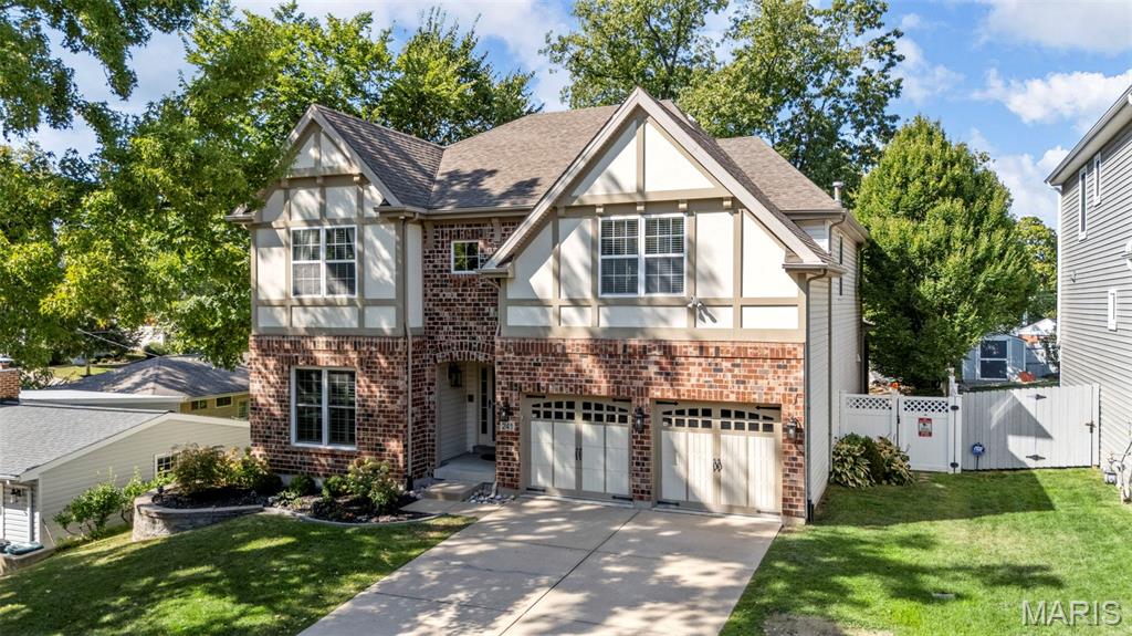 Quintessential 5 bedroom family home just blocks from downtown Kirkwood and walking distance to Kirkwood Park!  Private fenced-in back yard and new composite deck is a perfect fun-zone for kids and pets, parents can accompany in comfort of enclosed all-seasons room perfect for relaxing with coffee or wine.  Main floor office that greets with French doors upon entry is complete with full closet and could be utilized as ground-floor bedroom. Main floor open-concept kitchen and quartz center island adjoins hard-wood family room with cozy fireplace and built-in book shelving. Upstairs, 4 bedrooms circle around the stairs and a central sitting area and all can access 3 full baths recently updated.  Master en-suite with tray ceilings, bay window, his-and-her dual walk-in closets and master bath with separate tub, shower and dual sink.  Fully finished basement is perfect for entertaining with a wet bar, but also includes a full bath, closet and egress window that could be convenient for multi-generation or teens. Heating and cooling systems both brand new, plenty of basement storage. Family living is best in Kirkwood, welcome home!